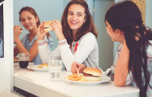 3 girls eating lunch at school