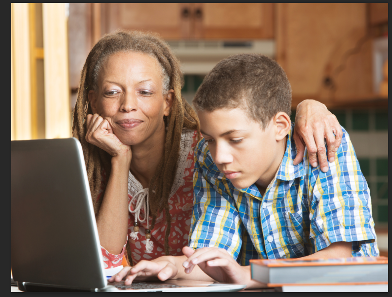 mom and son on laptop