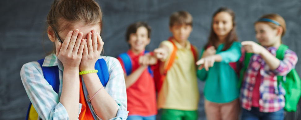 girl being bullied by 4 students