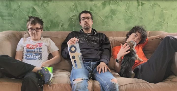 Gorski Brothers Emmett 11, Gavin 20 and Elliott 14 sitting on a couch