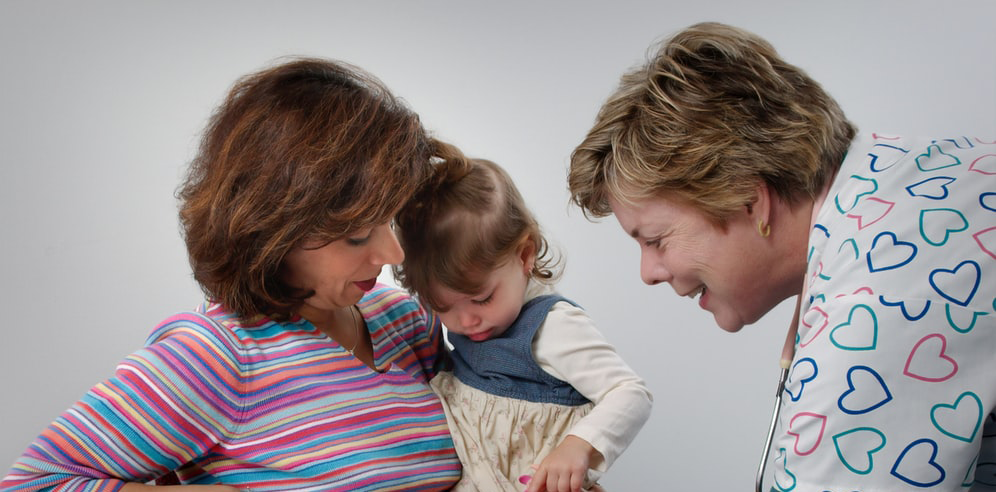 Mother and child with nurse