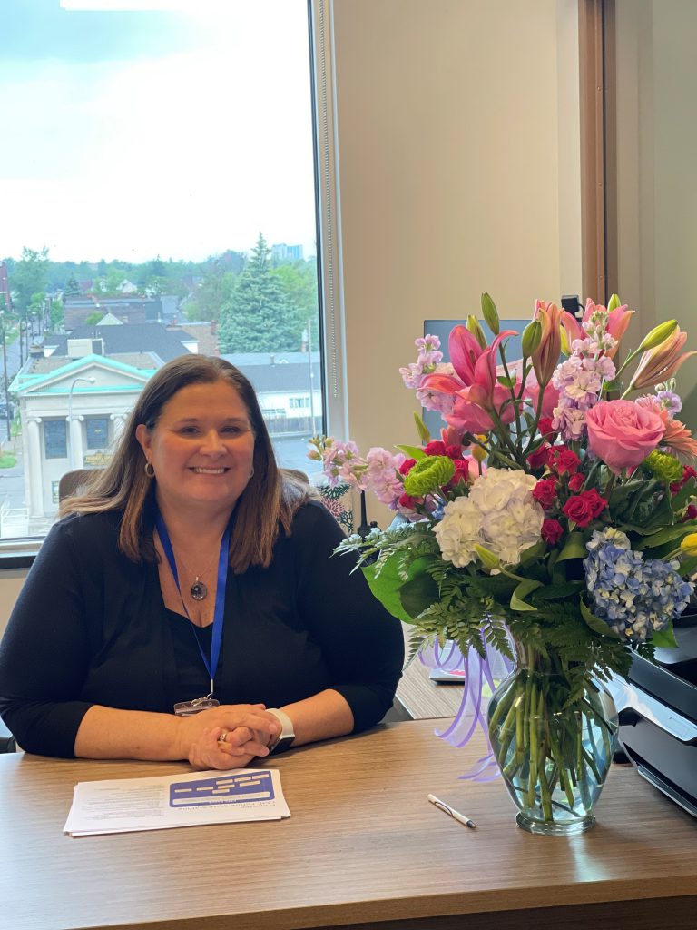 kim sitting at her desk