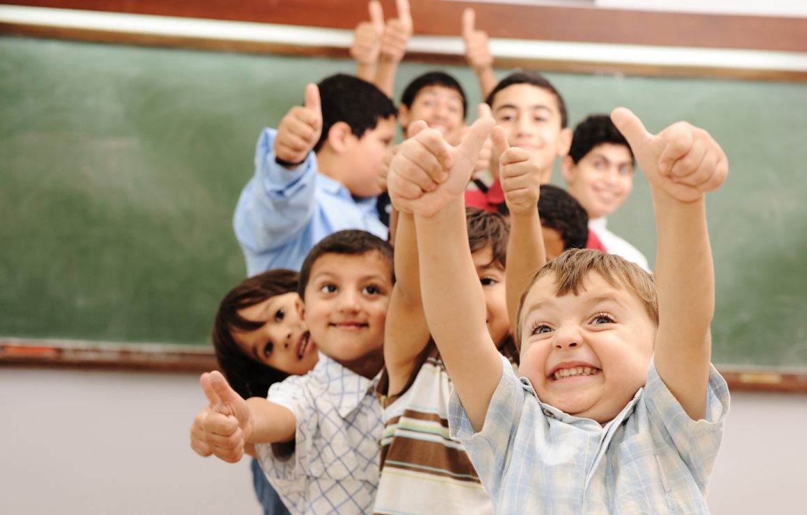 kids with thumbs up