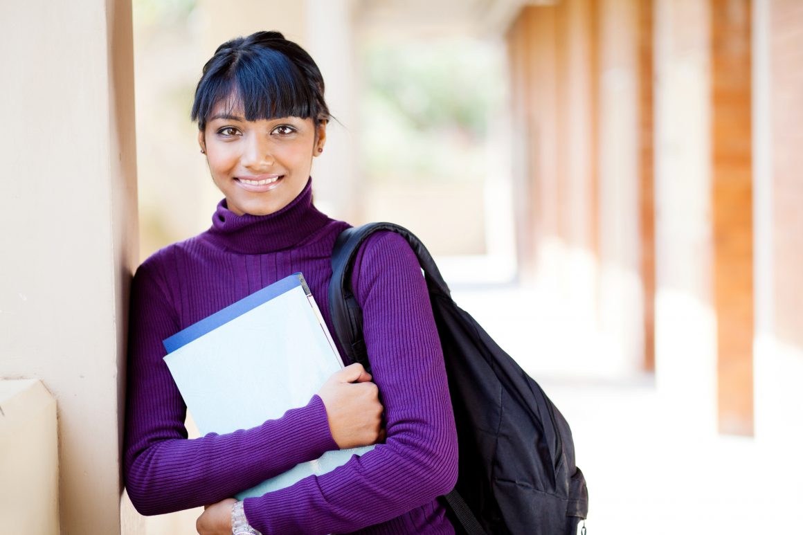 Young woman holding books