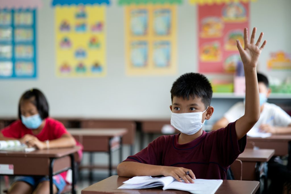 students in class wearing face masks
