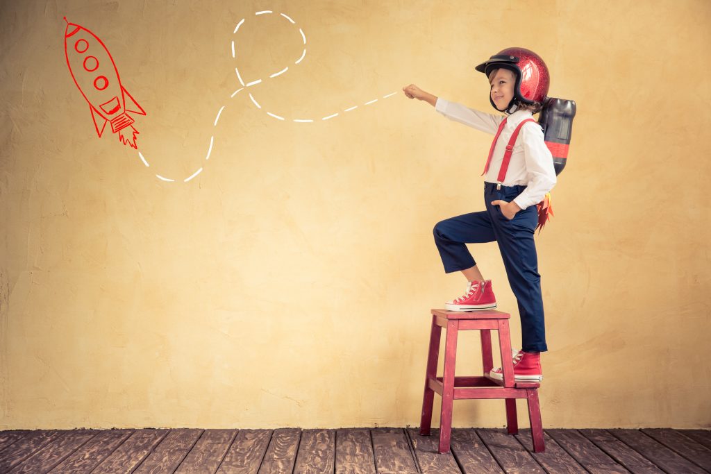 young child pretending to be an astronaut