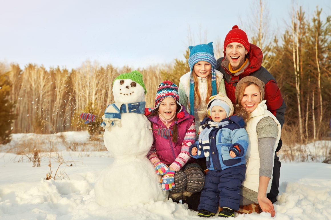 Family making snowman