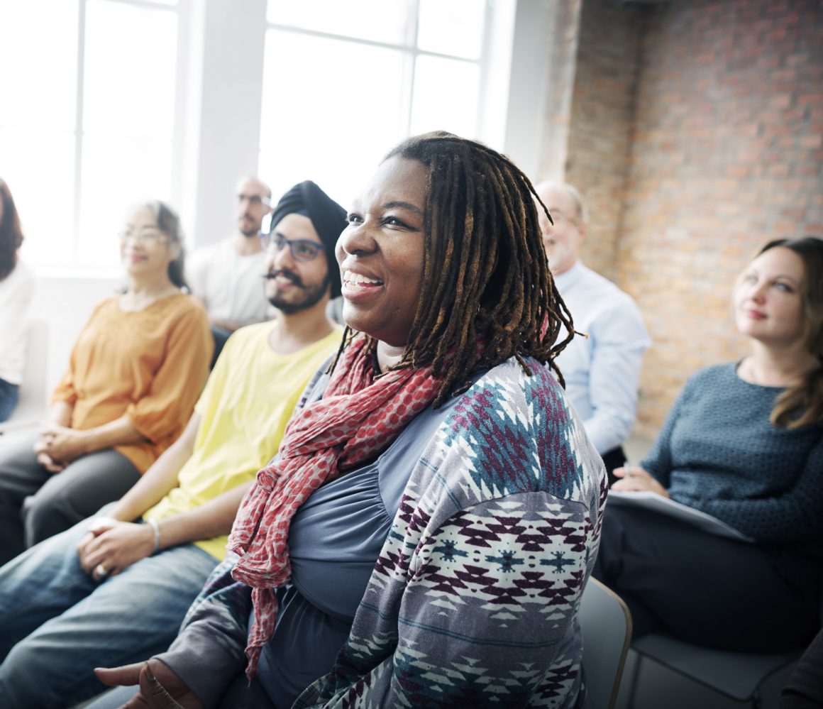 Parents sitting in a classroom together