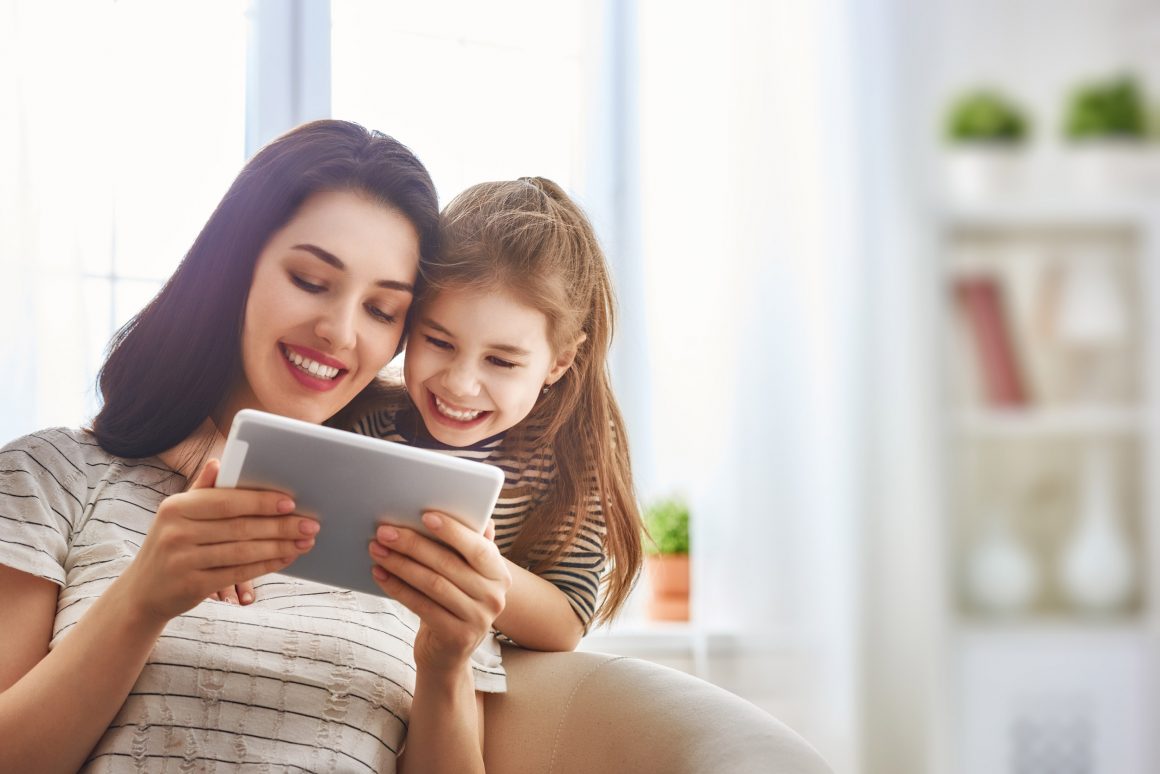 Mom and daughter on tablet