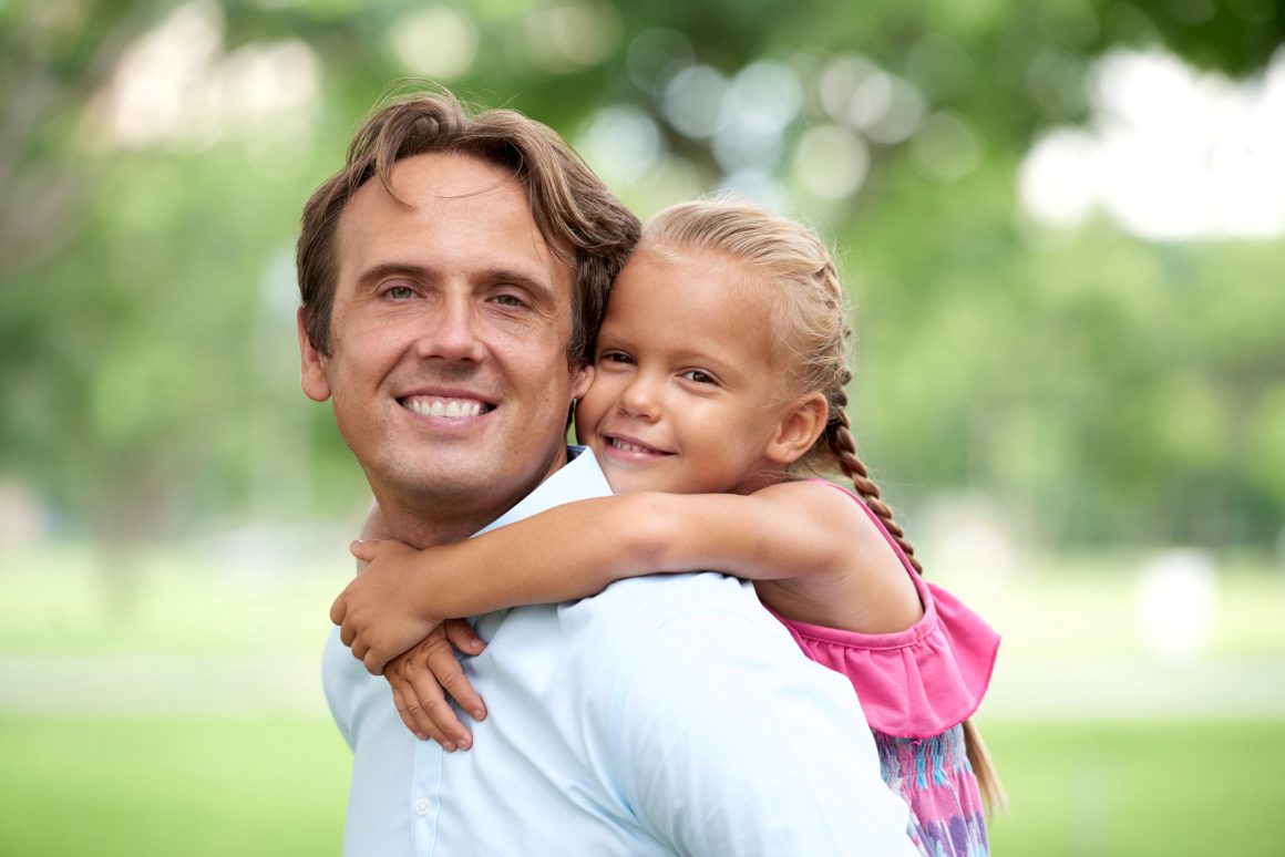 Father with daughter on his back